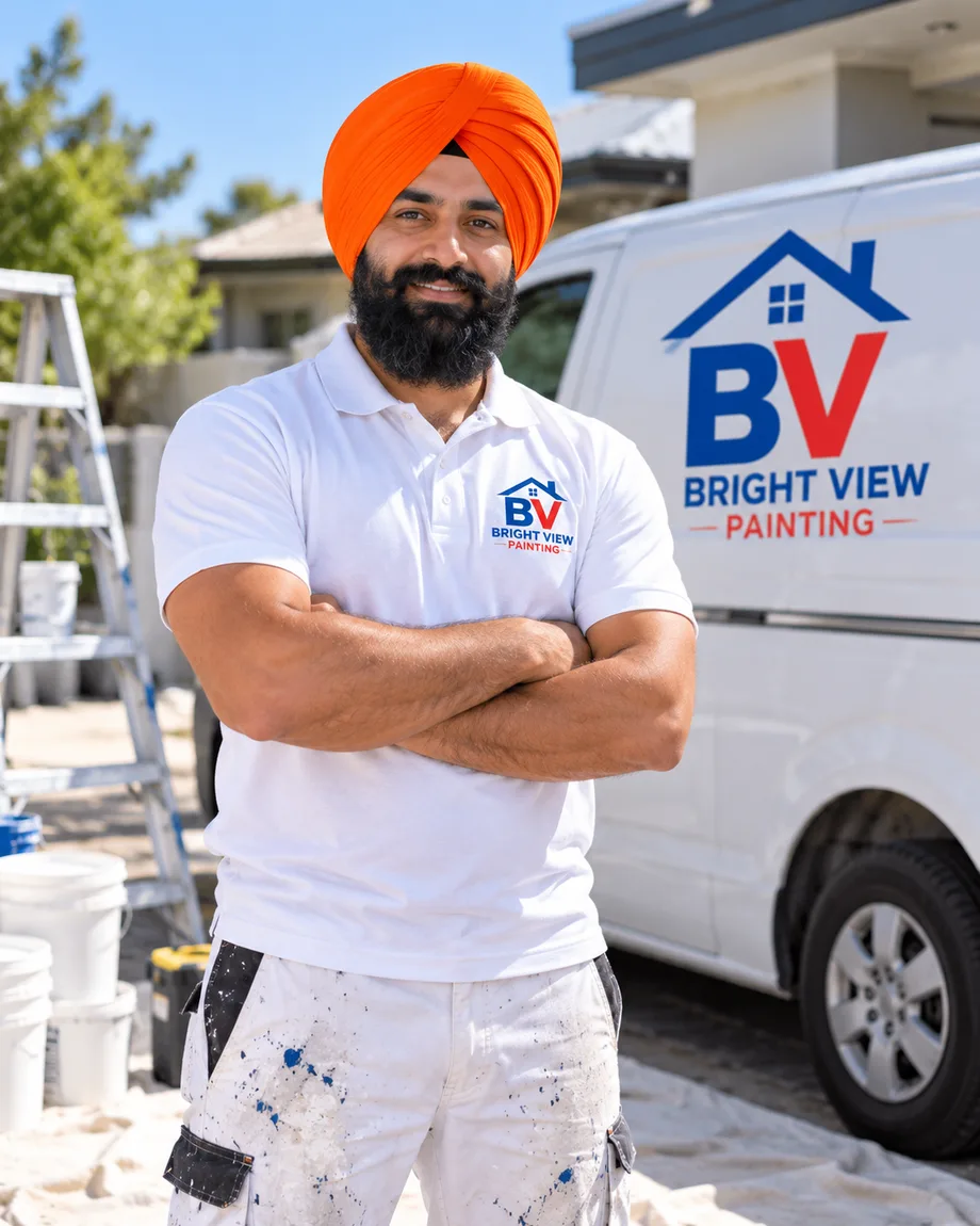Bright View Painting founder wearing an orange turban and branded painting uniform
